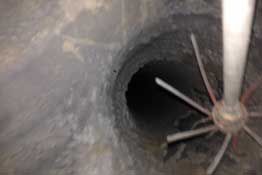 Interior look of a chimney being cleaned