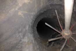 Interior image of a chimney flue being cleaned